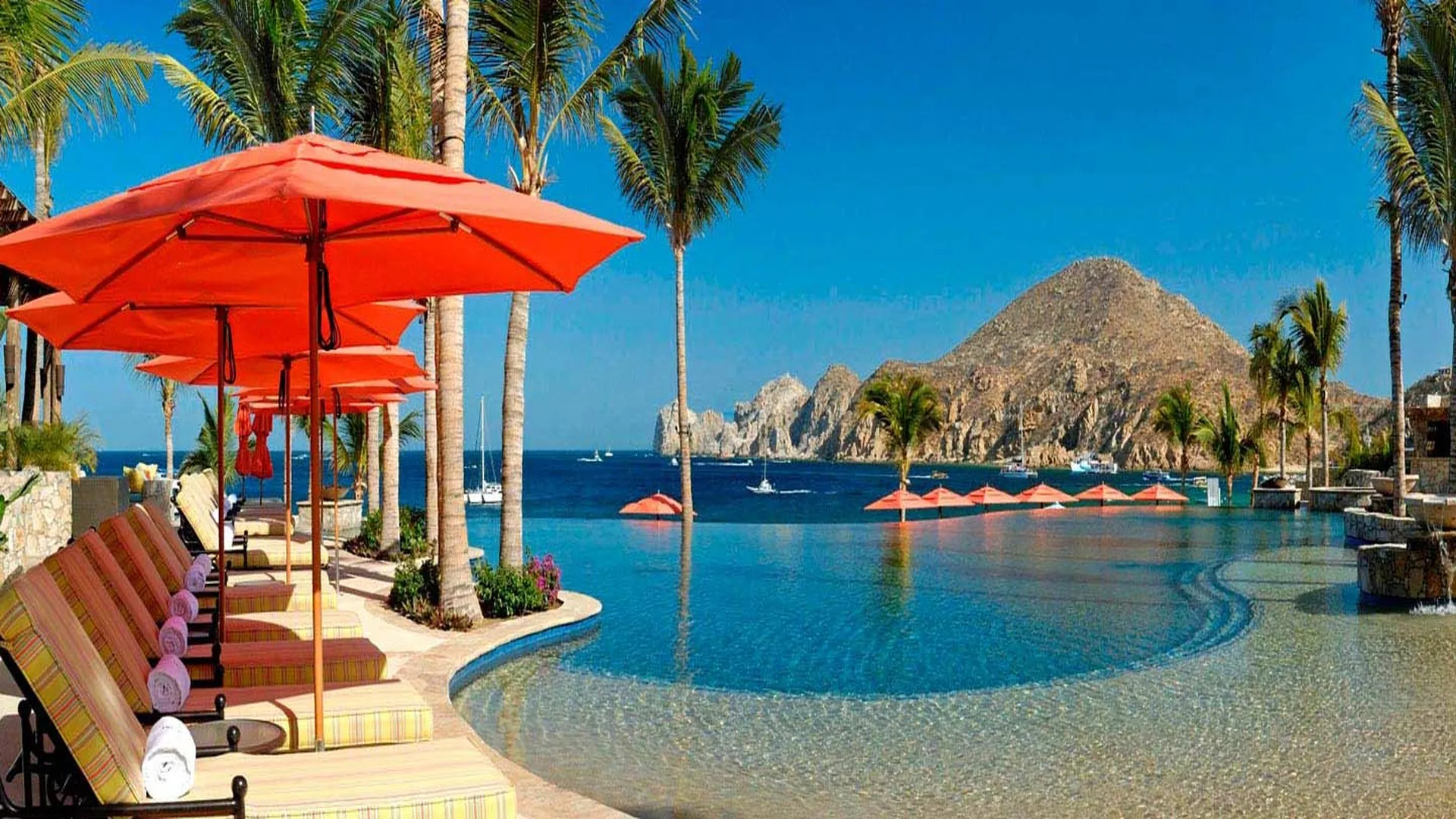 Main pool at Hacienda Beach Club with Land’s End in the background