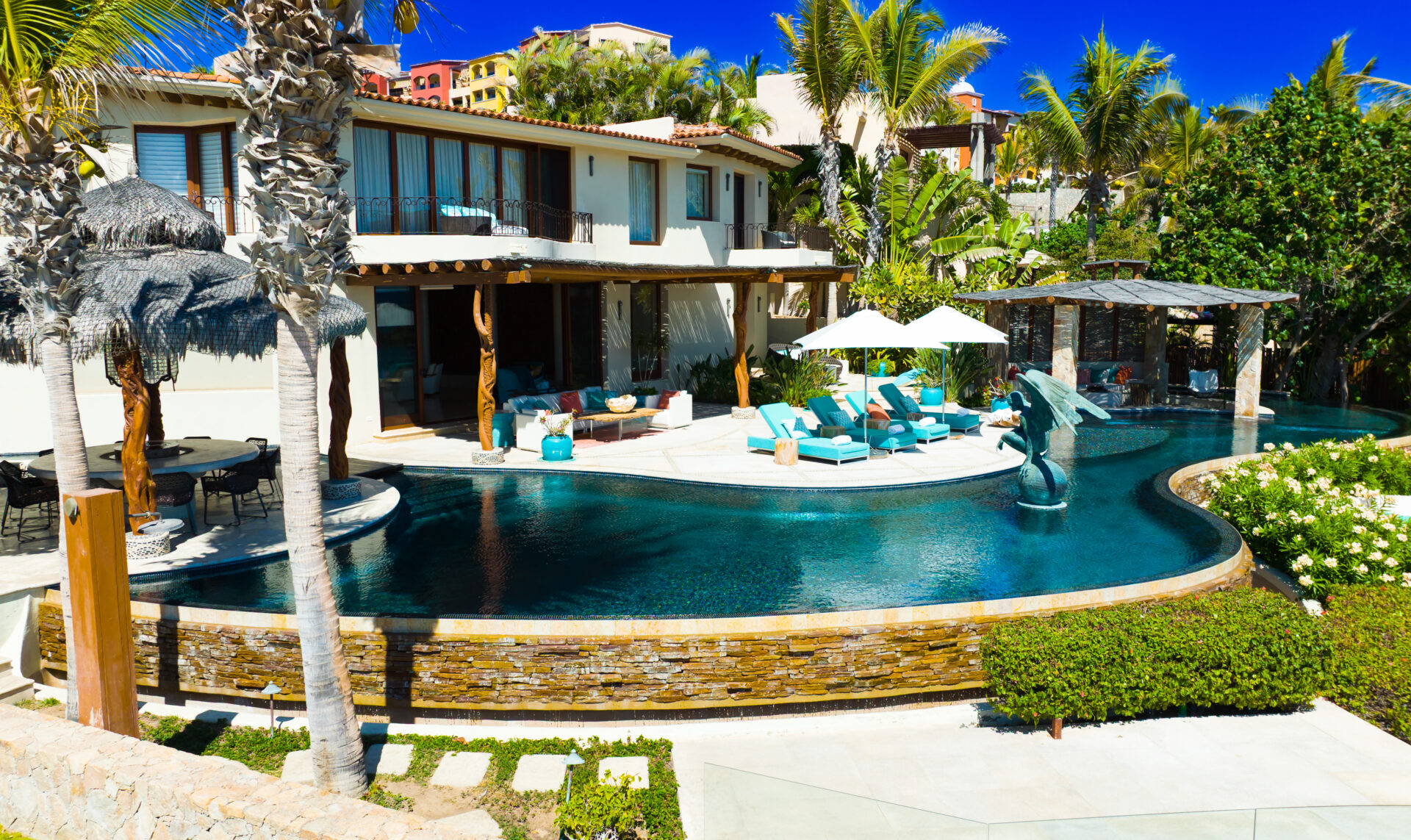 Private villa in Punta Ballena with a curved infinity pool and palapa