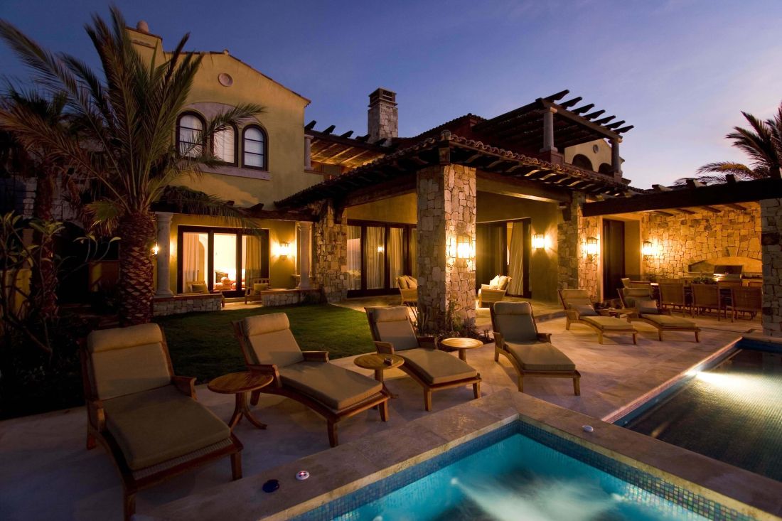 Hacienda-style villa at dusk in El Dorado Golf & Beach Club, Los Cabos