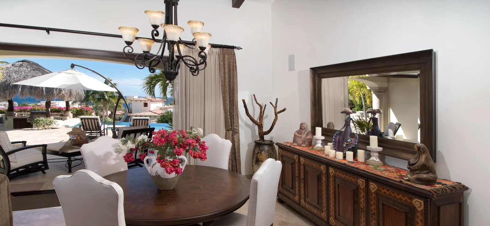 Hacienda-style interior opening to the pool at El Encanto de la Laguna