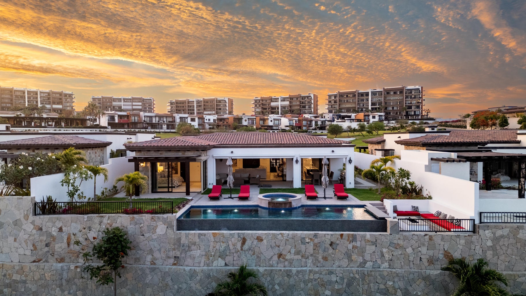 Single-level Coronado residence at Quivira with pool terrace at sunset