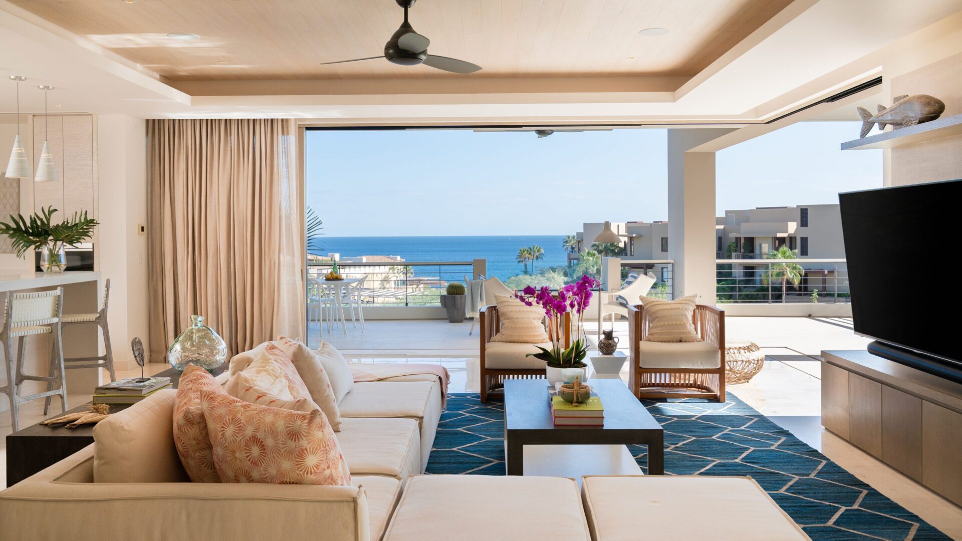 Living room of a Las Colinas home at Maravilla opening to the terrace and the Sea of Cortez