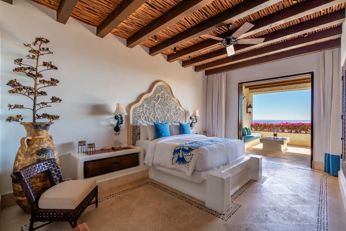 Bedroom of a residence at Las Ventanas al Paraíso opening onto a terrace over the Sea of Cortez