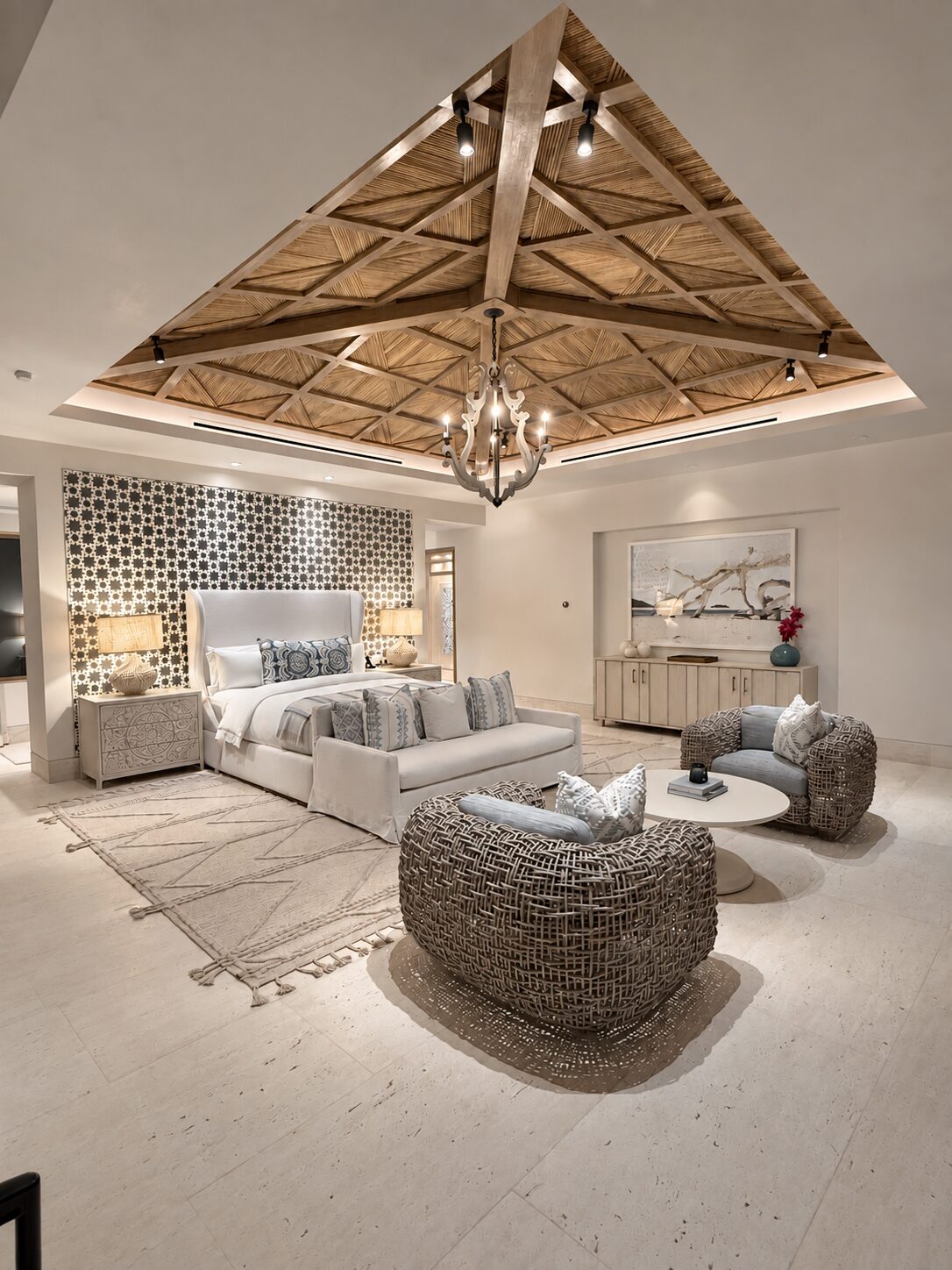 Master bedroom of a Maravilla home by Ohana Design Services, coffered wood ceiling and woven armchairs