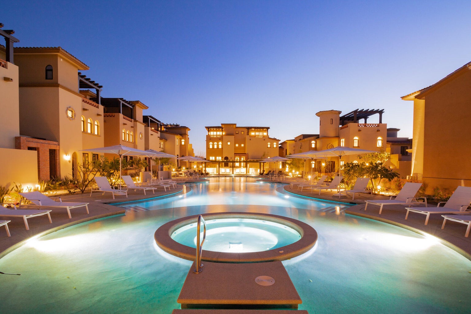 Mavila townhomes at Quivira around their shared pool at night