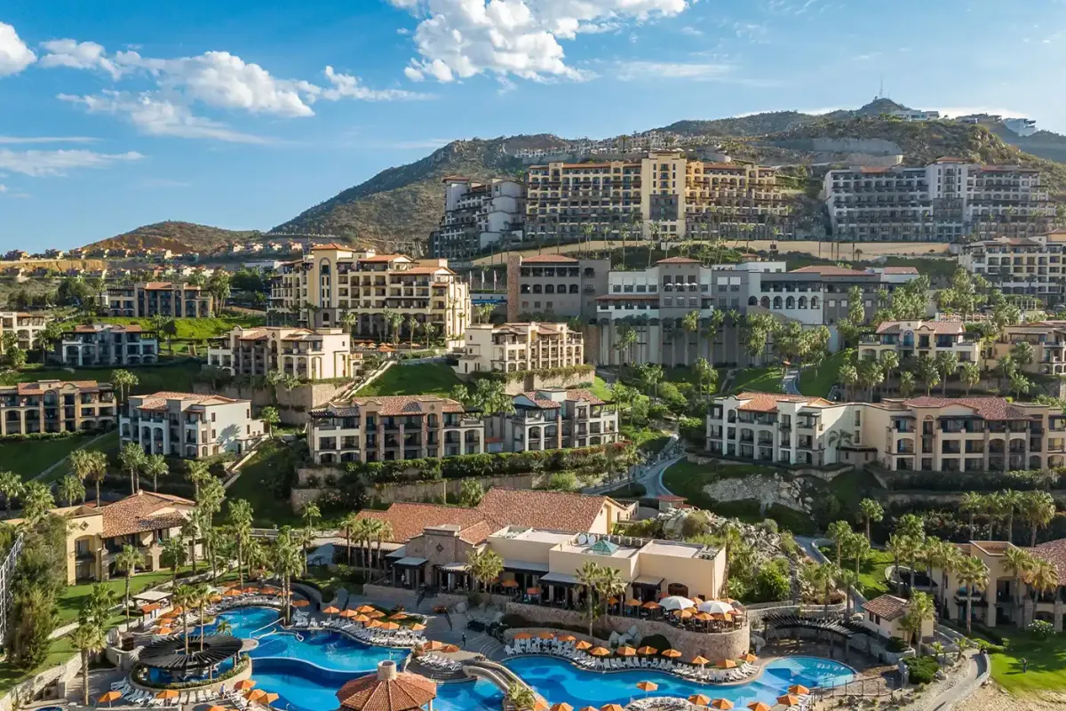Pueblo Bonito Sunset Beach, hacienda-style suites climbing the hillside above its pools