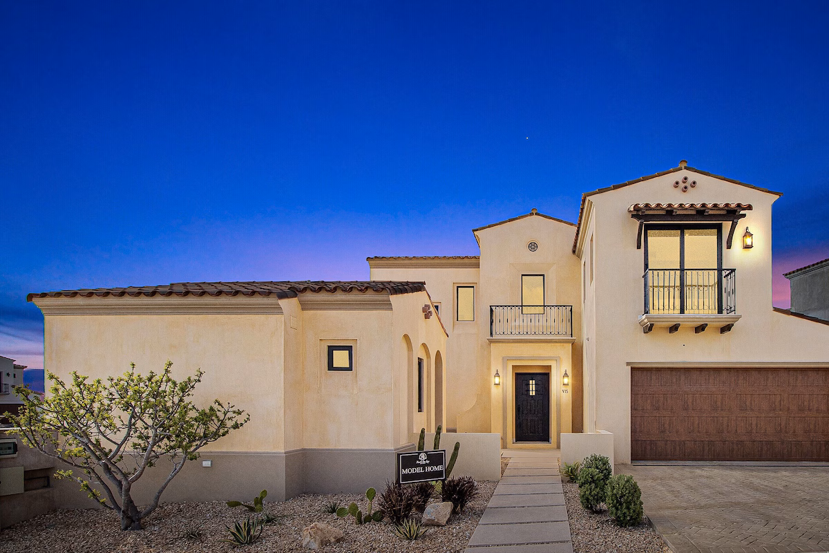 Model home of The Villas at Rancho San Lucas at blue hour, Santa Barbara style with tile roof