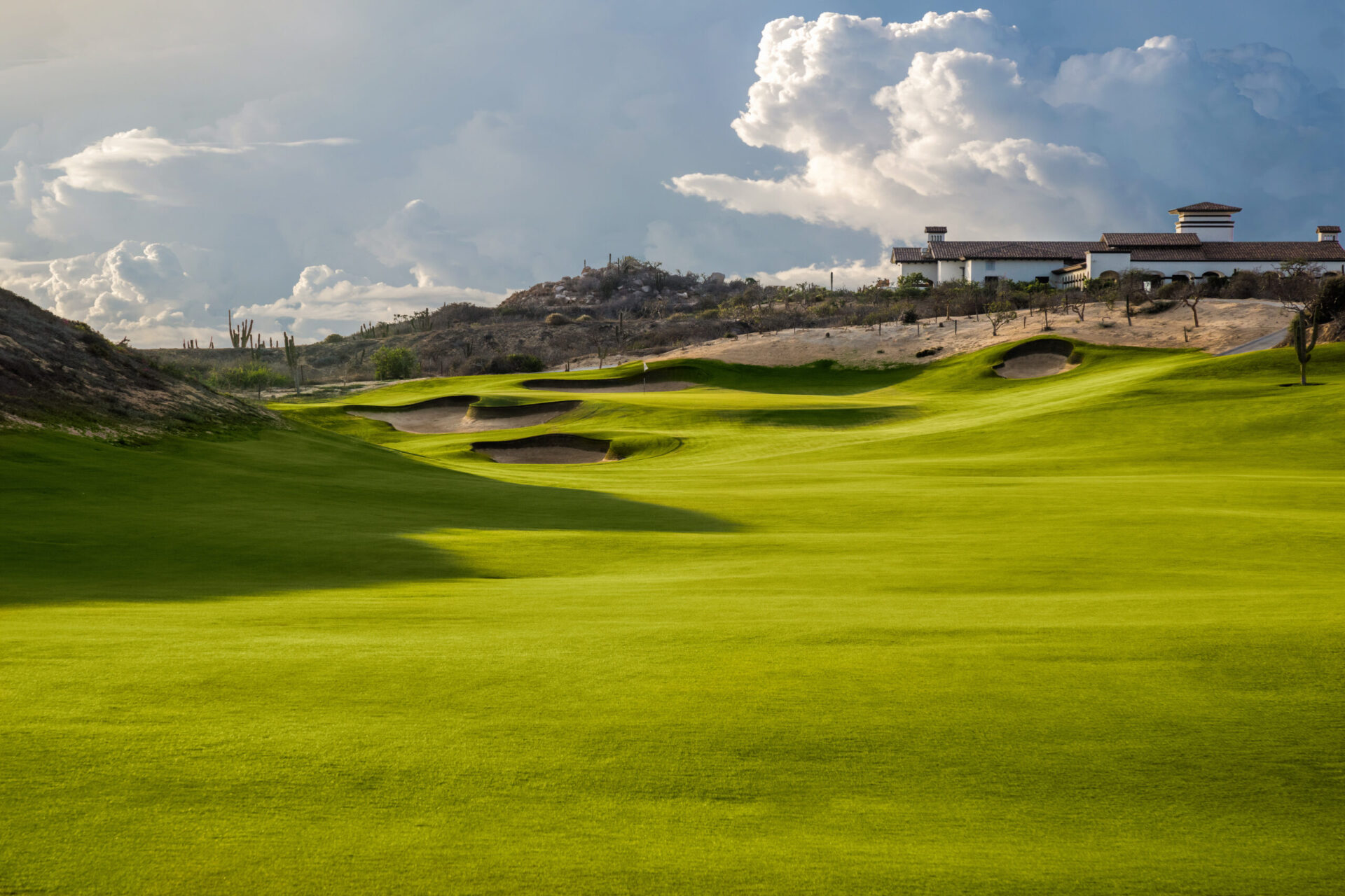 A fairway of Solmar Golf Links rising toward the clubhouse at Rancho San Lucas