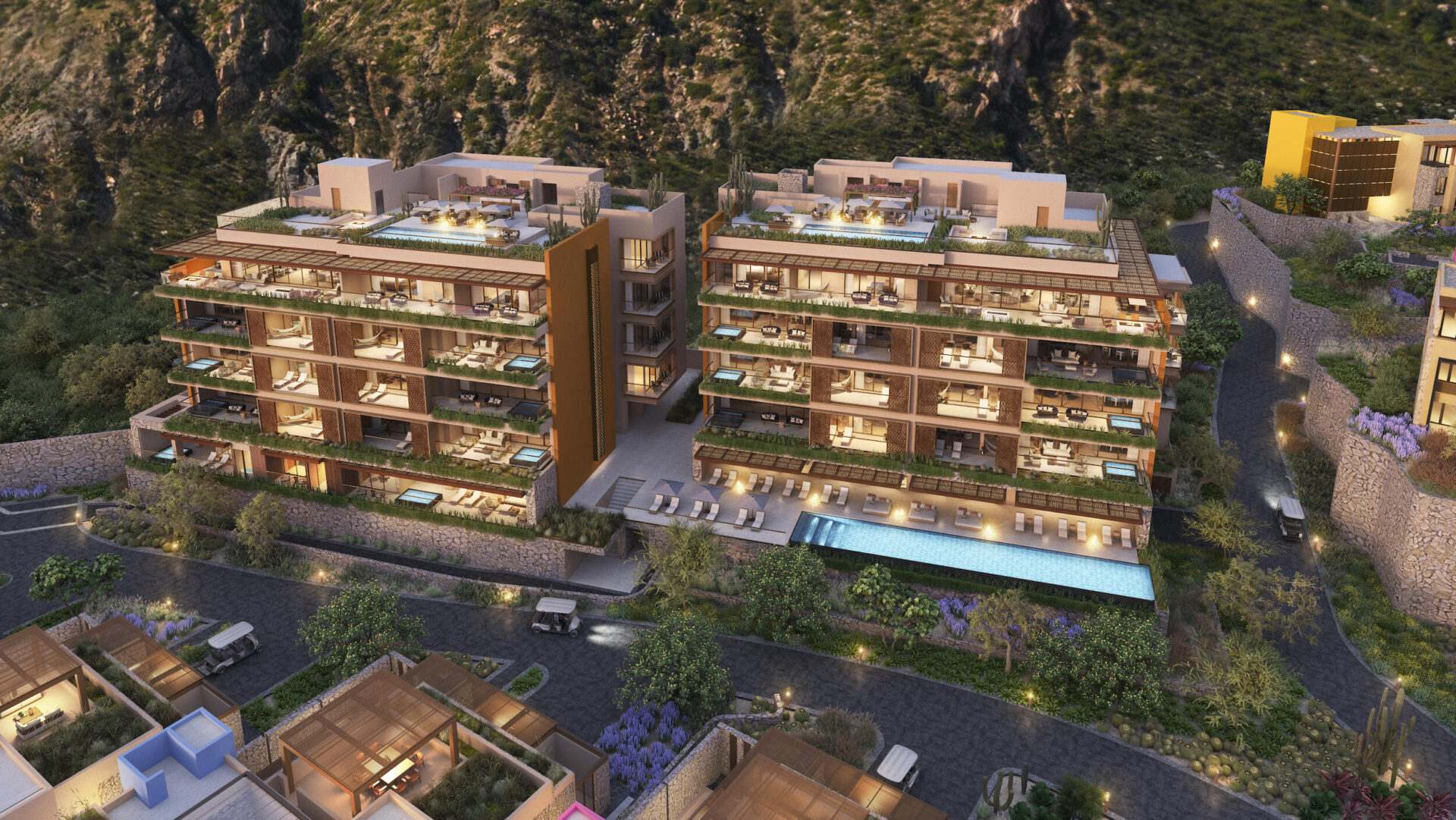 Aerial rendering of the St. Regis residences against the mountain at night, rooftop pools lit