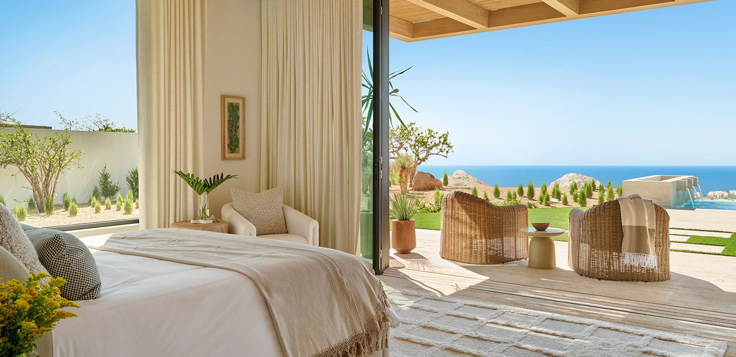 Bedroom of a Twin Dolphin Casita opening to the terrace, the pool and the Sea of Cortez