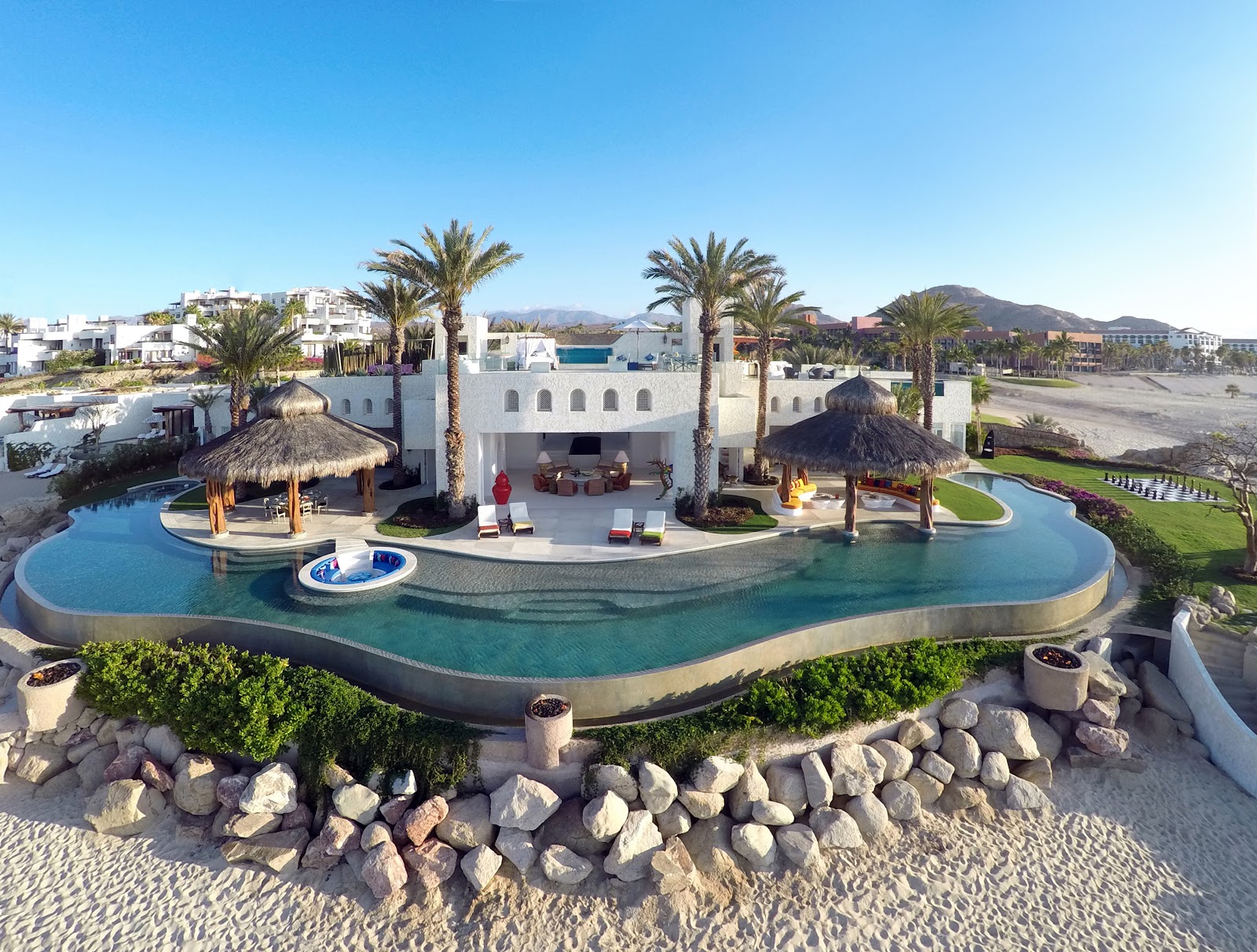 Aerial view of the Ty Warner Mansion at Las Ventanas al Paraíso with its 328-foot infinity pool on the beach