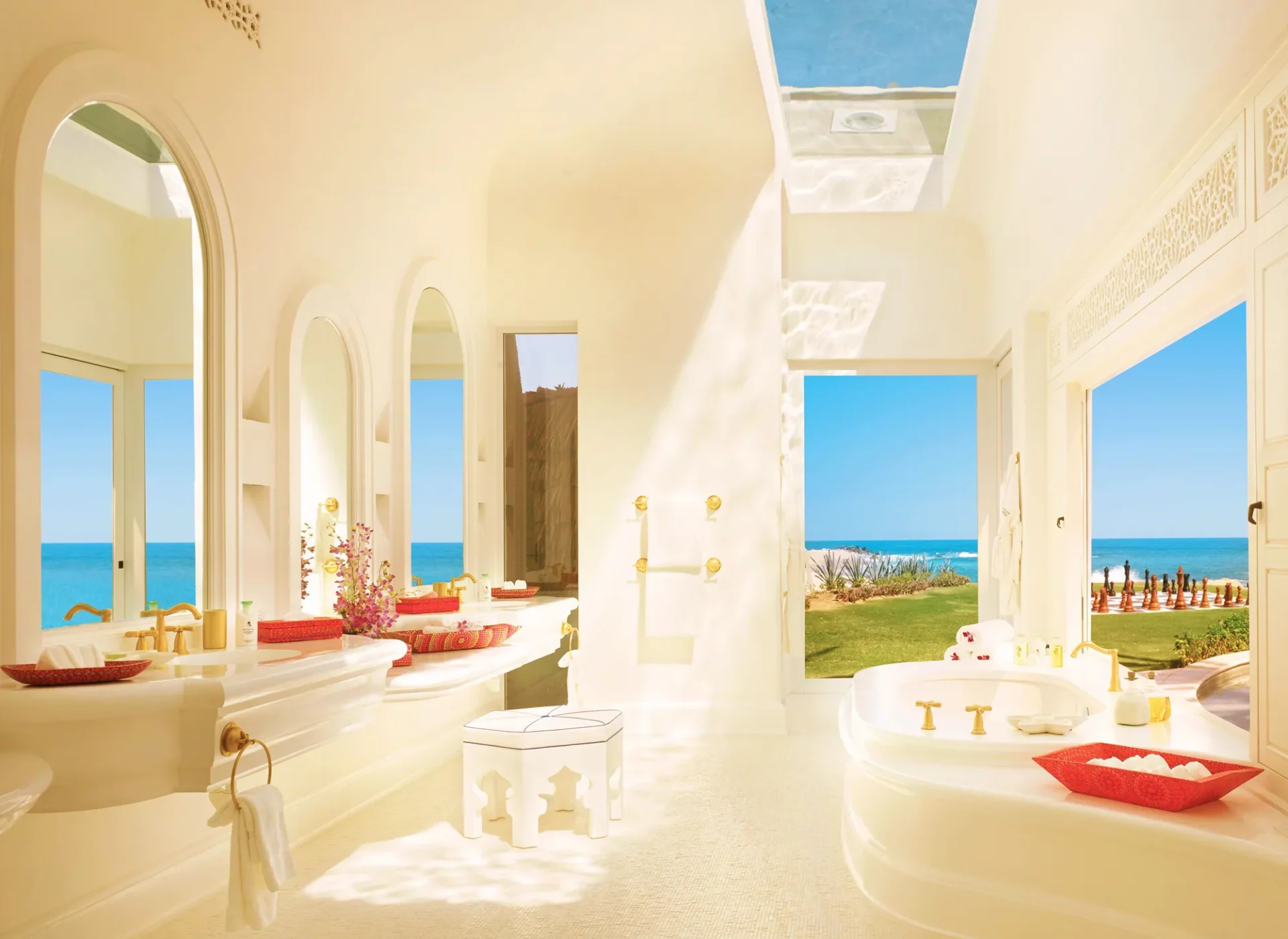 Master bath of the Ty Warner Mansion with arched mirrors and an open view of the Sea of Cortez