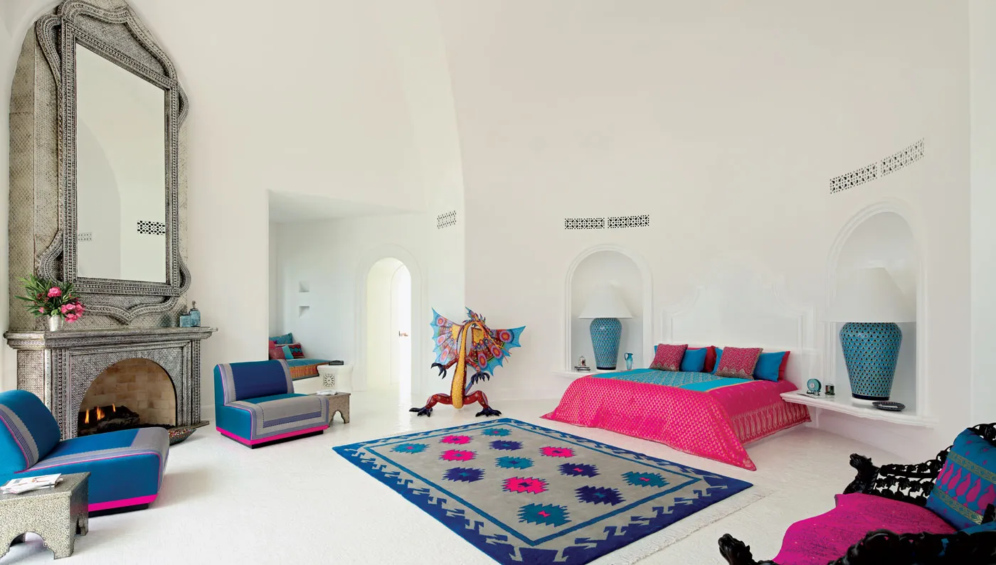 Master suite of the Ty Warner Mansion with vaulted white ceilings and Mexican textiles