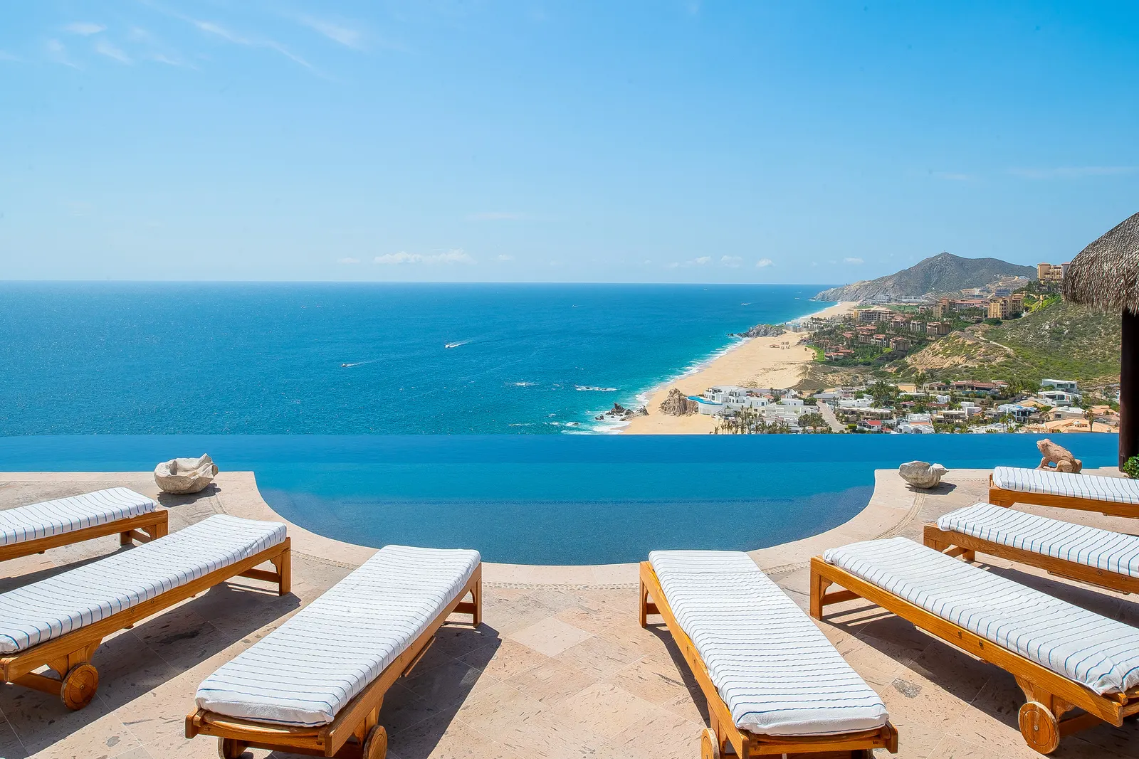 Infinity pool terrace in Pedregal looking down over the Pacific beach and the Cabo San Lucas hillside