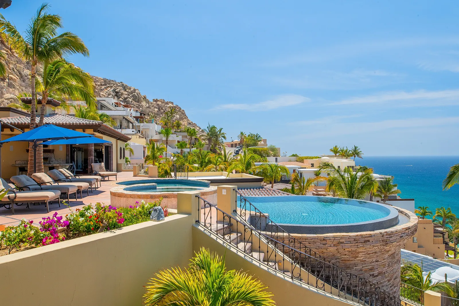 Terrace pools of a Pedregal villa stepping down the hillside toward the Pacific